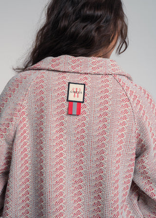 Back view of a unisex short jacket in premium cotton with a bold red and light grey duo-color design, featuring interchangeable buttons for a customizable look.