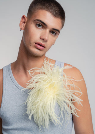 Unisex ostrich feather brooch accessory with a bold vanilla yellow design.