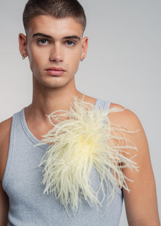 Unisex ostrich feather brooch accessory with a bold vanilla yellow design.